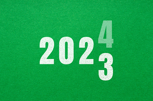 2024 lettering on green paper. New year 2024 concept.