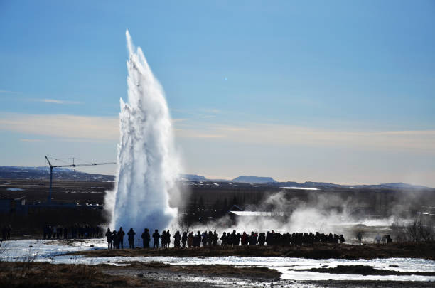 istock Icelandic geyser with tourists. 1840055695