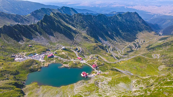 A scenic landscape featuring Balea Lake and the Transfagarasan Road in Fagaras Mountains in Romania