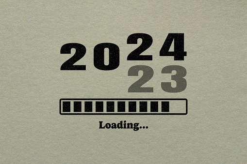 Loading 2024 symbol on paper. New year 2024 coming concept.