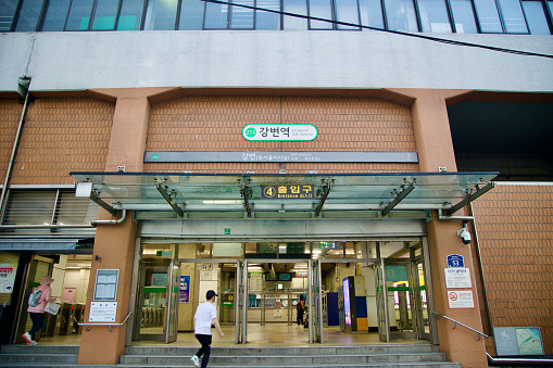 Gangbyeon Station, located adjacent to the bustling Dong Seoul Bus Terminal, serves as a vibrant entry point for commuters and travelers in Seoul. This image captures the dynamic atmosphere of the station's exterior, reflecting the city's efficient transportation network and urban charm.