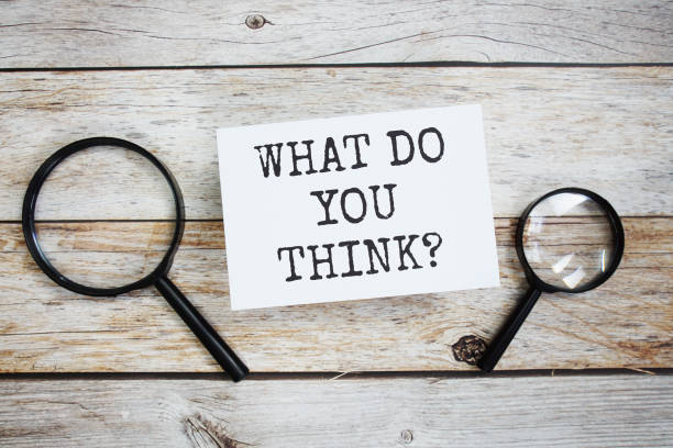 istock What do you think? text message with magnifying glass on wooden background 1840099416