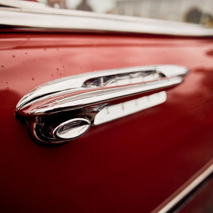 Close up of vintage car door handle.