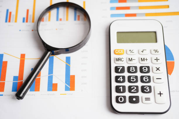istock Magnifying glass on charts graphs paper. Financial development, Banking Account, Statistics, Investment Analytic research data economy. 1840124760
