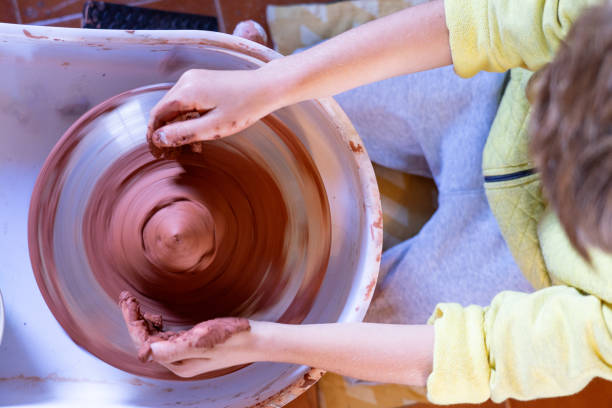 istock Potter's wheel seen from above with a child learning 1840130841