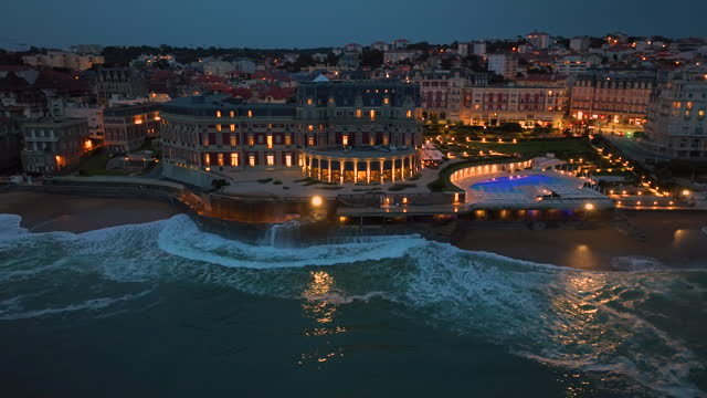 Biarritz large aerial view of the main beach and Biarritz city at night France. Everything along the coast is in lights and illumination