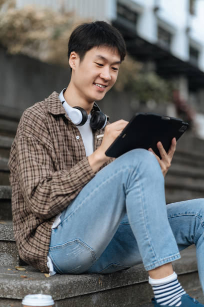 istock Students Reading Books In University Campus, summer vacation. 1840138362