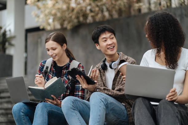 istock Education knowledge and university concept - group of students reading and preparing for exams on holiday. 1840139442