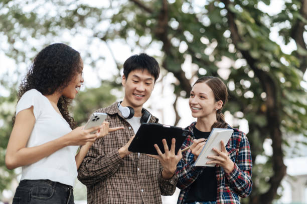 istock Education knowledge and university concept - group of students reading and preparing for exams on holiday. 1840139462