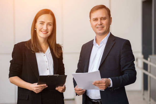 istock Young business partners caught on camera during conversation 1840141094