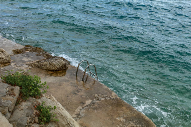 istock Dangerous entrance, sharp and slippery stones 1840159379