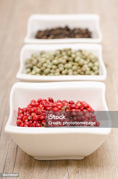 Red Peppercorns In Vertical Format Stock Photo - Download Image Now - Black Color, Black Peppercorn, Bowl