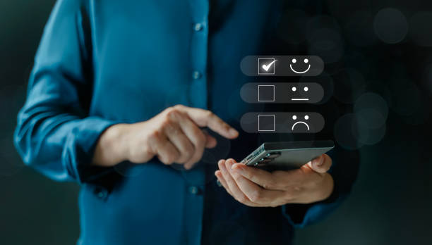 istock customer services best excellent business rating experience. Satisfaction survey concept. Hand of a businessman chooses a smile face on mobile feedback. 5 Star Satisfaction. 1840186406