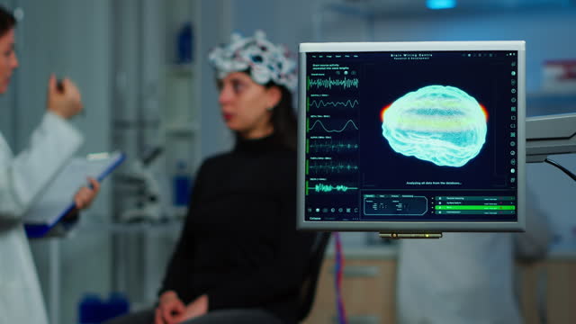 Neurologist doctor analysing nervous system using eeg headset