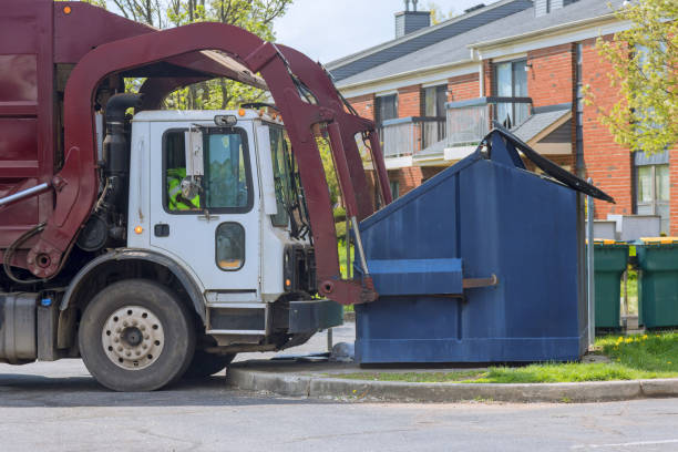 Municipal sanitation disposal service recycling garbage collector truck loading waste a trash bin