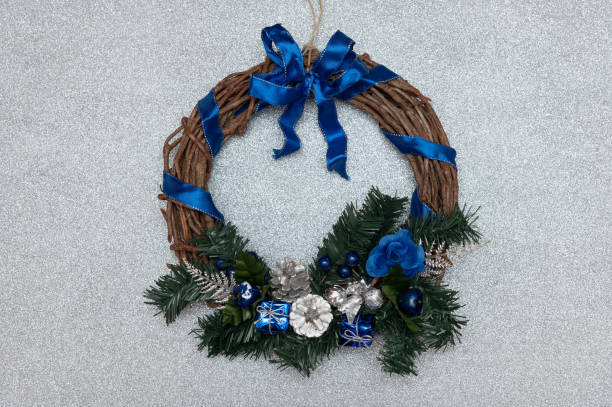 istock Homemade christmas wreath on a silver glitter background 1840220167