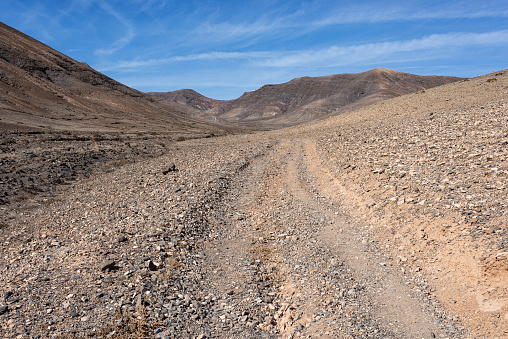 Gravel road at Playa de los Pozos in the south of canary island Lanzarote