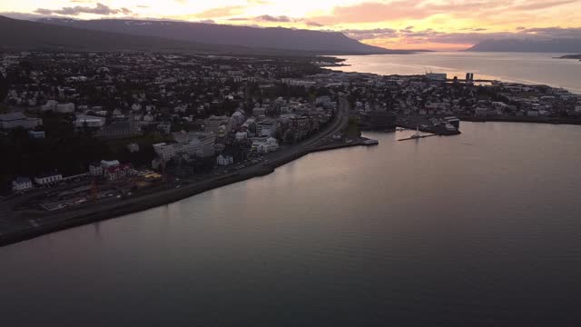 Aerial reveal of Akureyri, Iceland at sunset