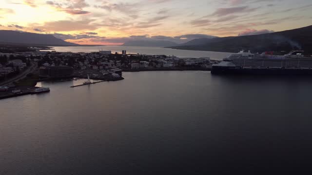 Sunset over cruise ship port in Akureyri, Iceland