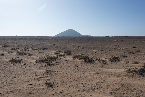 Distant volcanoe and El Jable desert on canary island Lanzarote