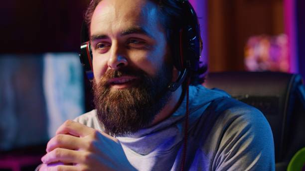 istock Professional gamer talking with his friends, engaging in online competitive multiplayer tourney 1840259632