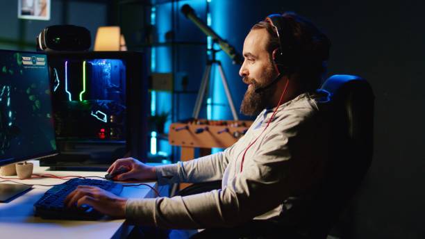 istock Player fights enemies with internet teammates in coop SF videogame 1840263362