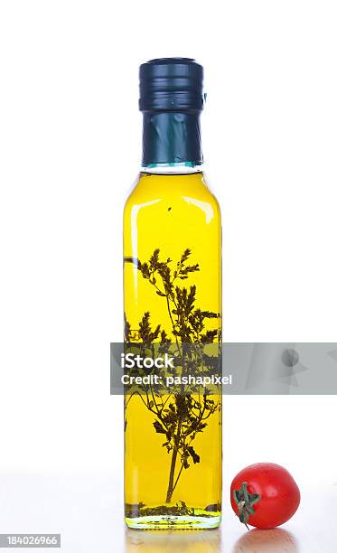 Olive Oil In Bottle Stock Photo - Download Image Now - Canola, Cherry Tomato, Close-up