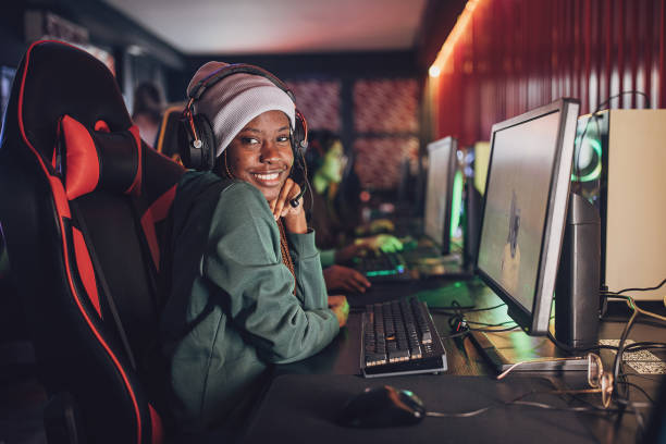 istock Smiling Young Black Woman Playing Video Games On PC 1840277177