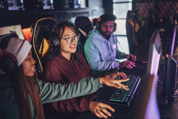 istock Team of Friends Discussing Video Game Strategy 1840295264