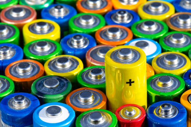 istock Old used batteries. Batteries background 1840307424