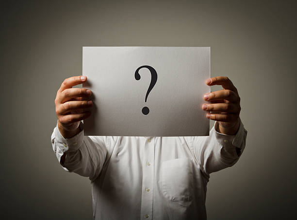 istock Question-mark. Man in white holding paper. 184031692