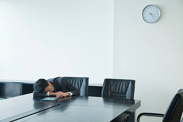 istock Businessman sleeping in office room 184031832