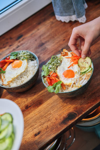 istock Mars - Energy Efficient Cooking: Preparing Bibimbap Bowl With Vegetables, Fried Egg and Ben’s Rice 1840327124
