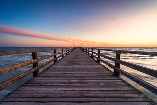 Beautiful sunrise over a bridge at the baltic sea