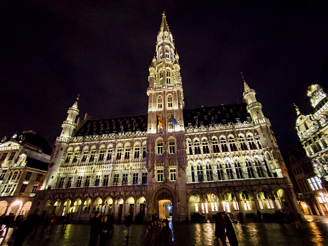 People are visiting at night famous cityhall of brussel belgium