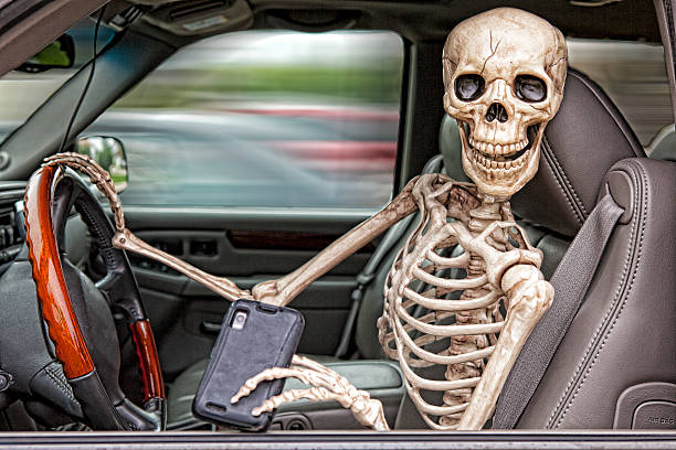 skeleton текстурные и управление - mobile phone seat belt text messaging smiling стоковые фото и изображения