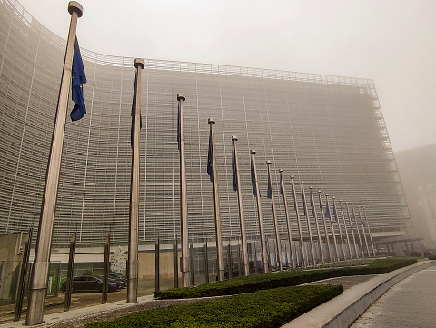 Brussels, Belgium. 30th Oct. 2019.  The European Union flags fly at half-mast as a tribute to former French President Jacques Chirac in front of the European Commission building.