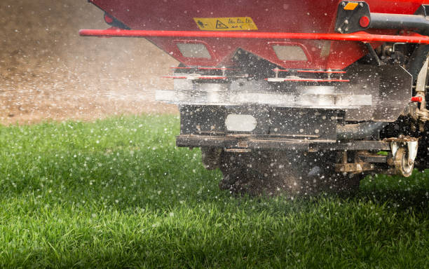 istock tractor fertilizing in field 1840358245
