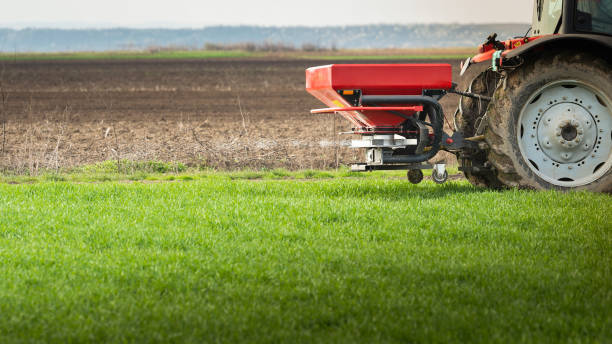 istock tractor fertilizing in field 1840358783