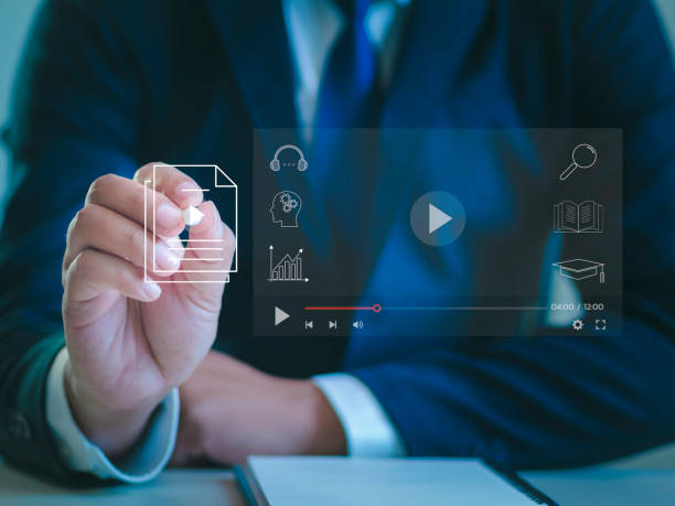 istock e-learning concept Businessman touching virtual screen to stream online on virtual screen Watch videos on the internet Online seminar Education on the Internet 1840374179