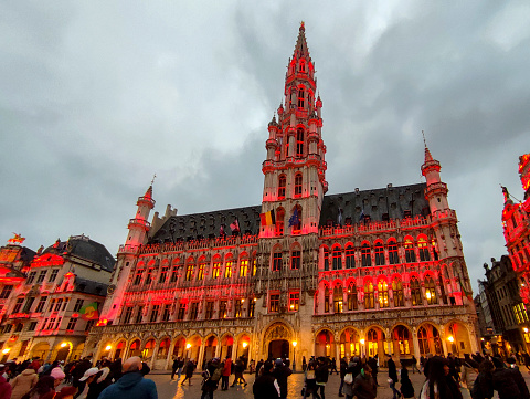 People are visiting at night famous cityhall of brussel belgium