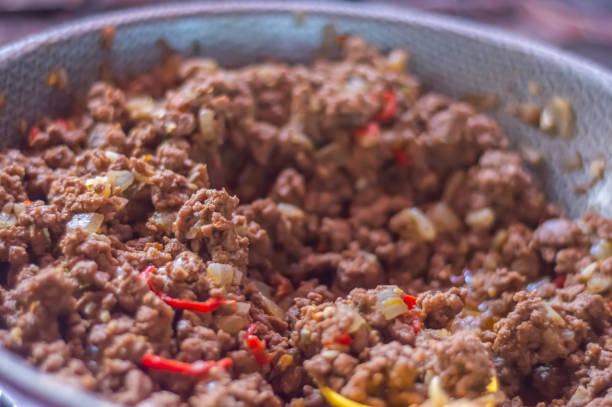 istock Ready-made ground beef seasoned with red peppers, meat texture 1840392751