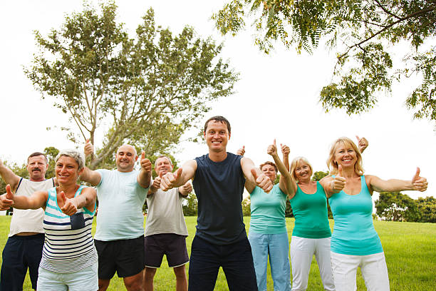 istock People group showing thumbs up 184039752