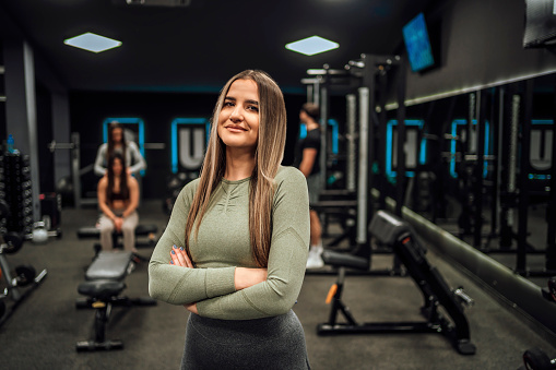 Portrait of a young female fitness trainer at the gym