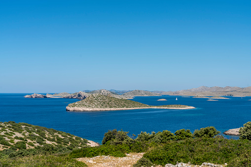 View on Kornati islands from the top of island Mana. Sunny day, clear blue sky.