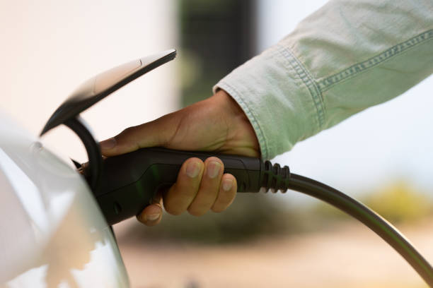 istock Male and charging electric car 1840426481