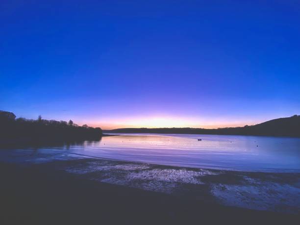istock Purple Sunset On The Water 1840429600