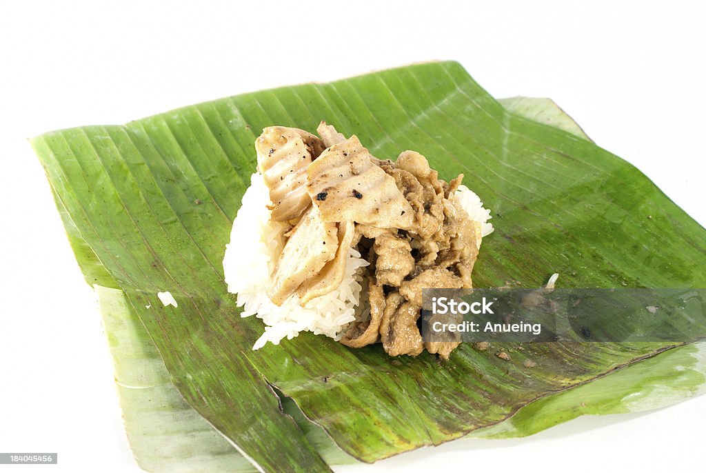 stick rice with pork wrapped banana leaves on white background, stick rice with pork wrapped in banana leaves on white background, traditional and street food in thailand Appetizer Stock Photo
