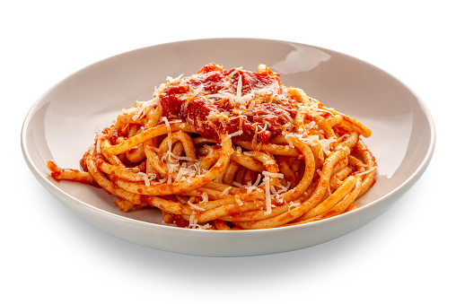 Bucatini pasta with tomato sauce and parmesan cheese in white plate isolated  with clipping Path