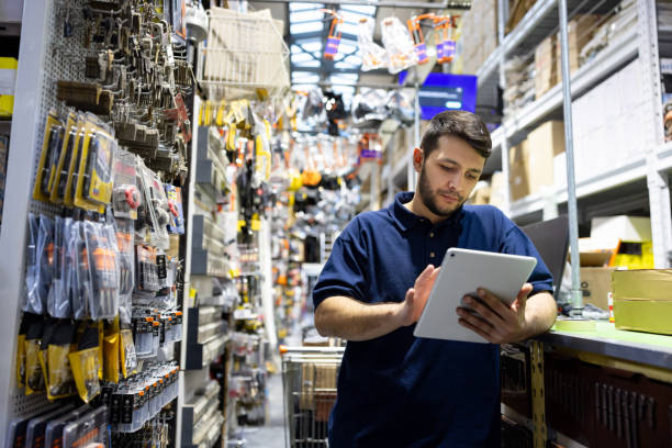 istock Employee working at a hardware store taking inventory 1840466278